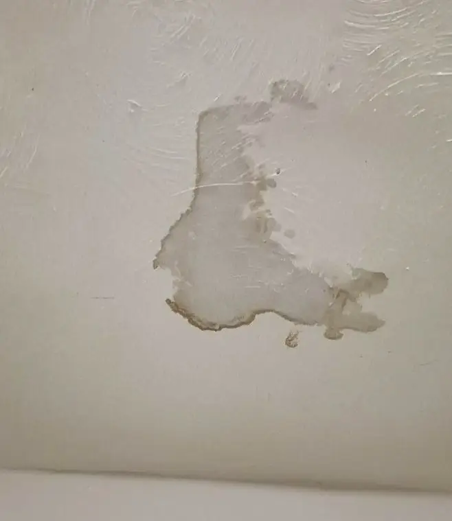 ceiling with water stain from roof leak